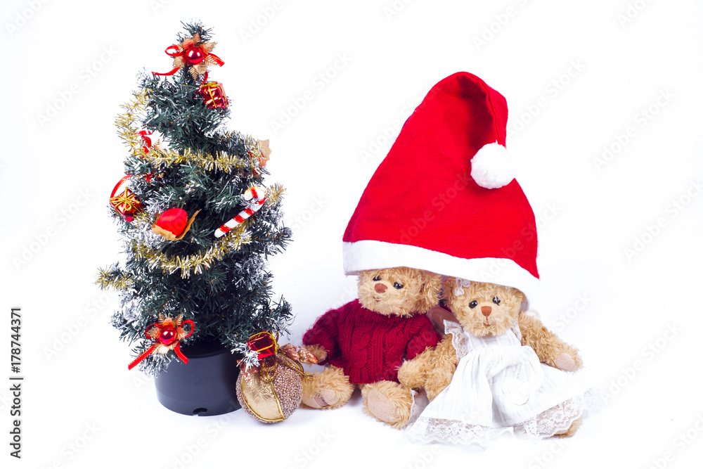Plush bear cubs near an artificial Christmas tree with Santa Claus. imitation of the family under the hood Plush bear cubs near an artificial Christmas tree with Santa Claus. imitation of the family under the hood