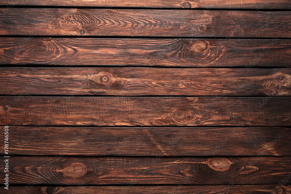 Fototapeta premium Texture of boards of dark old brown wood