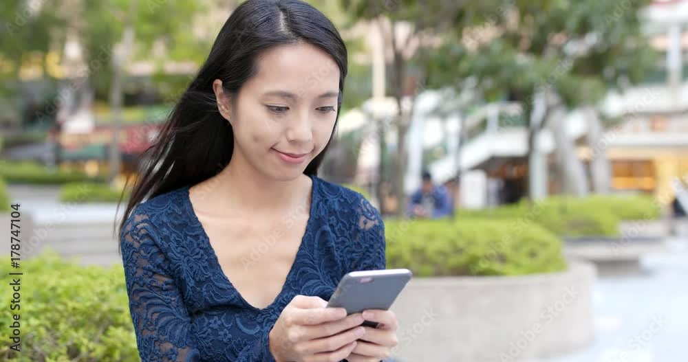 Woman use of mobile phone at outdoor Woman use of mobile phone at outdoor