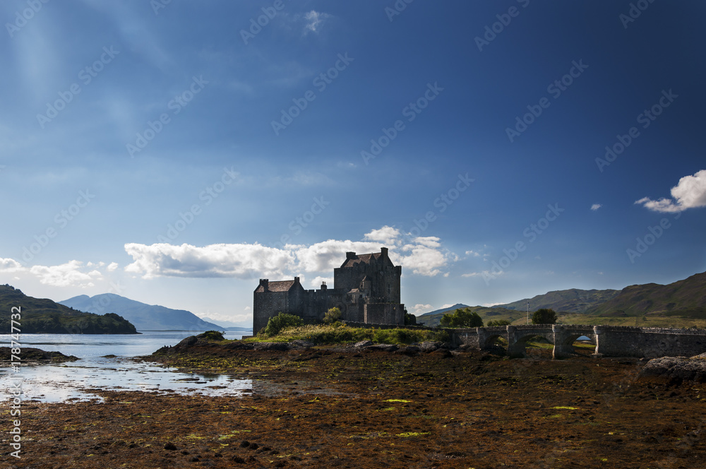 View of the Eilean Donan Castle in the Highlands of Scotland, United Kingdom; Concept for travel in Scotland View of the Eilean Donan Castle in the Highlands of Scotland, United Kingdom; Concept for travel in Scotland