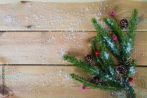 fir branches on wooden table