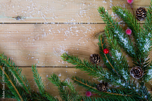 fir branches on wooden table