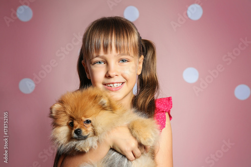 Cute girl with little dog o...
