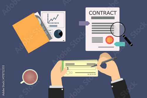 hands of businessman signing a check when closing the contract. On the table there is a folder with graphs of the company's performance.