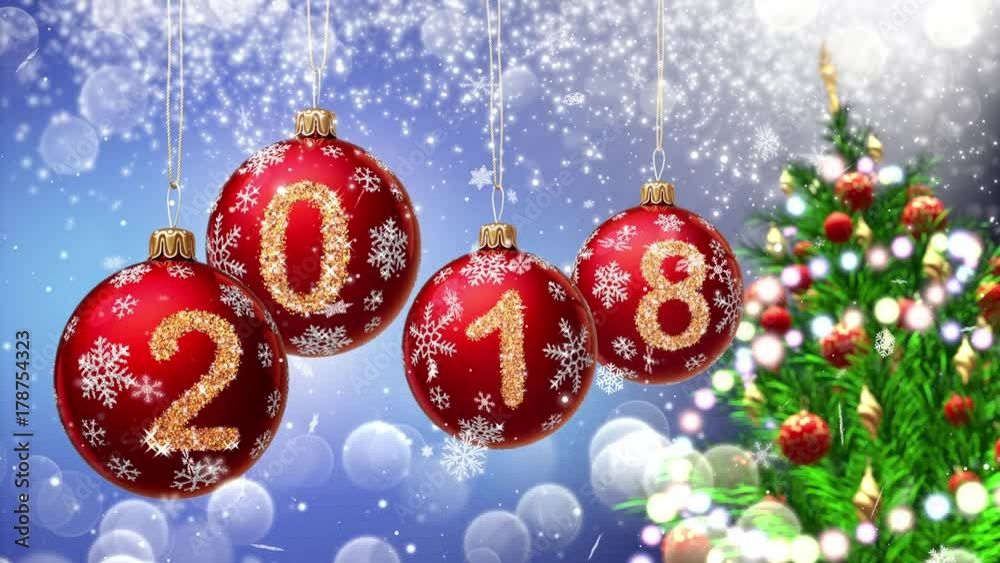 red balls with numbers 2018 hanging on the background of a blue bokeh and a rotating Christmas tree 3d rendering.