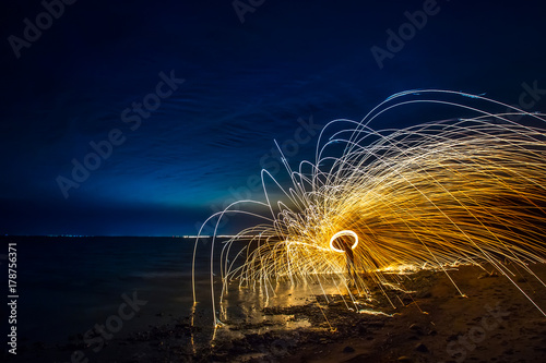 Flying sparks over the wate...