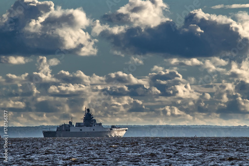 A warship in the background...