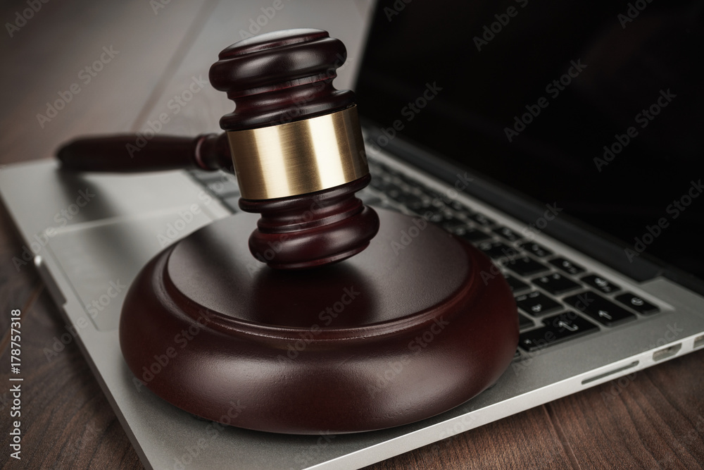 judge gavel on a laptop cyber crime concept judge gavel on a laptop cyber crime concept