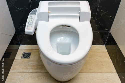 Fotografie Modern high tech toilet with hygienic and high technology of the toilet bowl, au