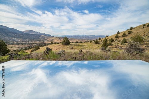 Wide open skies reflection of landscape blue sky mirror desert