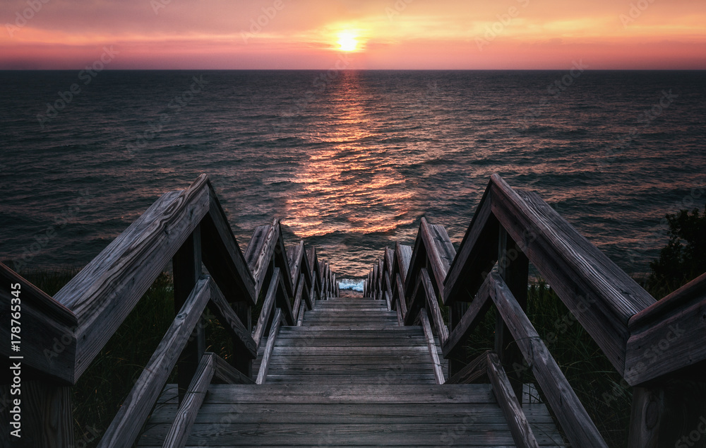 Surreal Sunset Stairway to the Sea. Low Key Vintage Style with Copy Space.