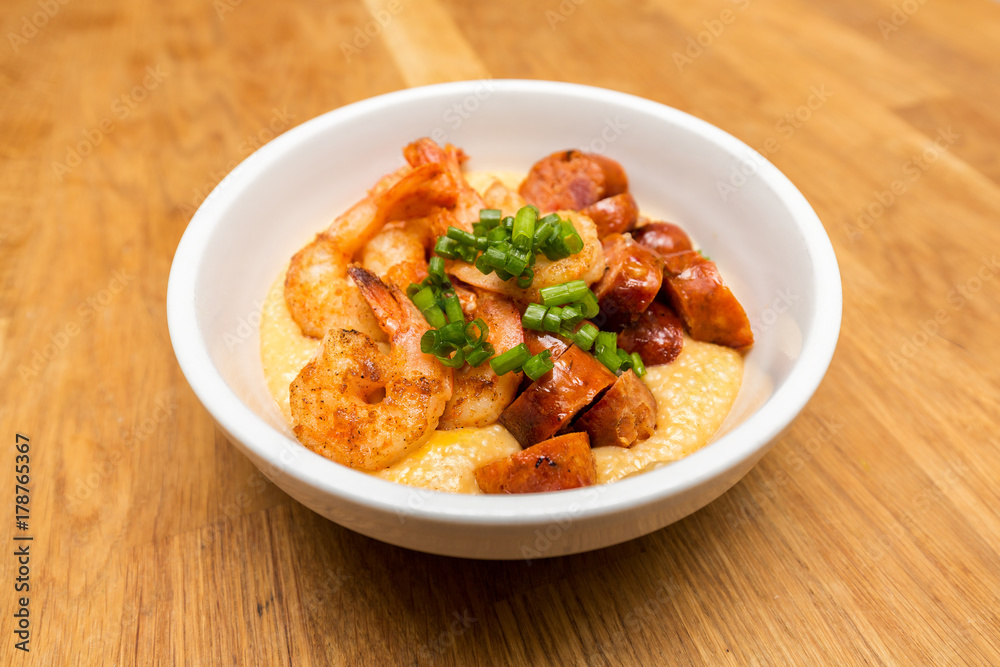 Shrimp and cheese grits with andouille sausage and green onions. Shrimp and cheese grits with andouille sausage and green onions.