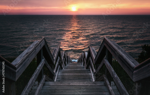 Surreal Sunset Stairway to the Sea. Low Key Vintage Style with Copy Space.