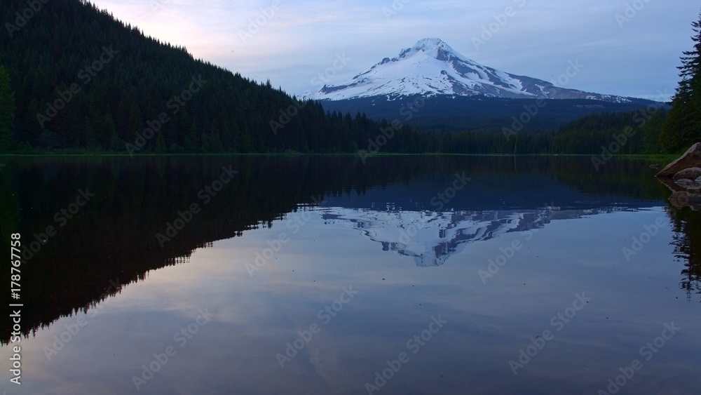 Reflection of mountain on forest lake Trillium Lake at Sunset with Mt. Hood Reflection Wide Reflection of mountain on forest lake Trillium Lake at Sunset with Mt. Hood Reflection Wide