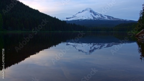 Reflection of mountain on forest lake Trillium Lake at Sunset with Mt. Hood Reflection Wide