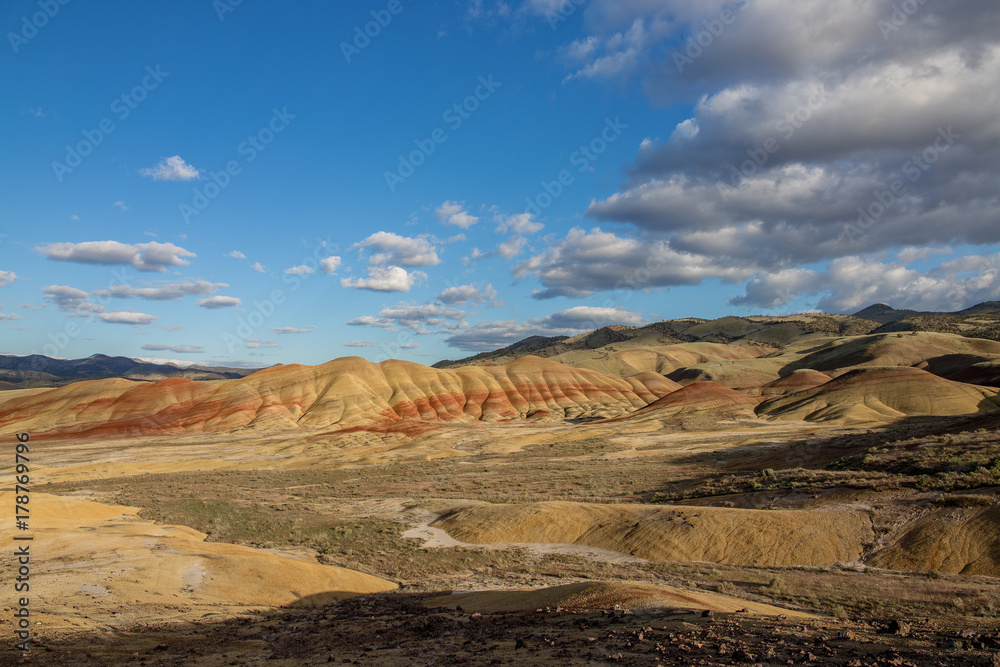 Painted Hills in spring bright with clouds