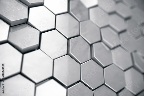 Fototapeta Naklejka Na Ścianę i Meble -  Silver abstract hexagonal background with depth of field effect. Structure of a large number of hexagons. Steel honeycomb wall texture, shiny hexagon clusters background, 3D rendering