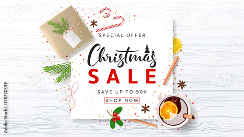 Promo Banner for Christmas Sale. Festive Composition with Paper Gift Box and Xmas Symbols for Happy New Year on Wooden Texture. Beautiful Greeting Card. Vector Illustration with Discount Offer.