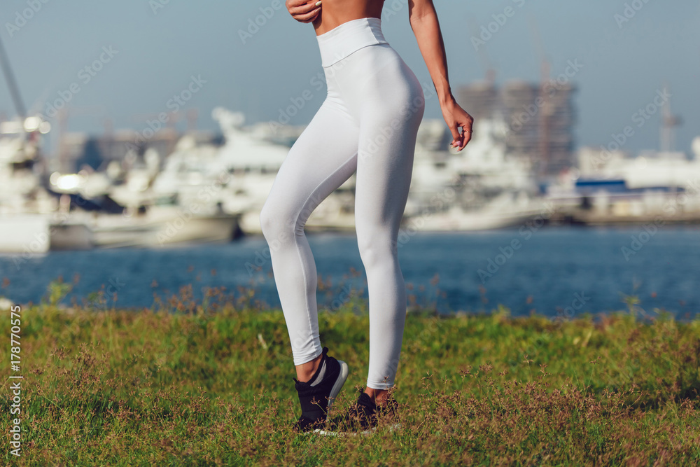 Legs of a sexy girl in leggings. Mock-up. Outdoor. Stock Photo | Adobe Stock
