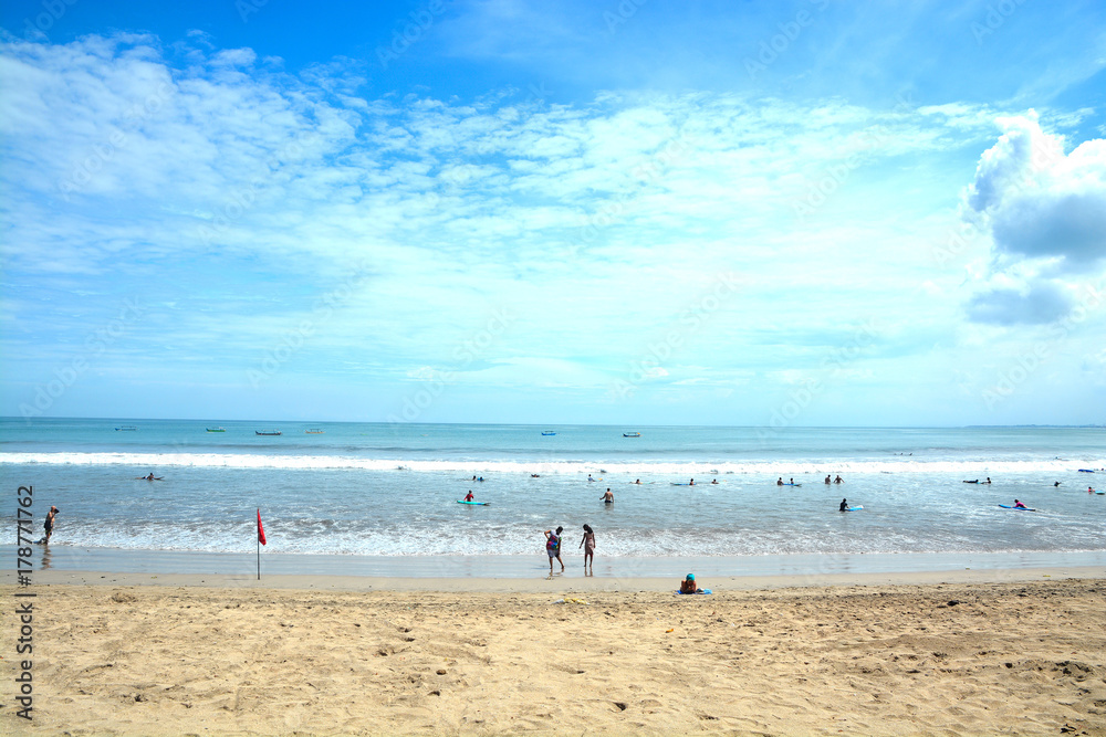 Kuta Beach in Bali, Indonesia. Famous beach with blue skies and white sands.
