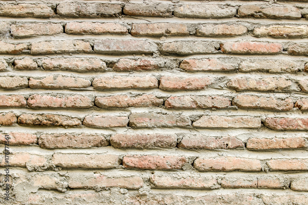 Naklejka premium Vintage light brown brick wall texture.