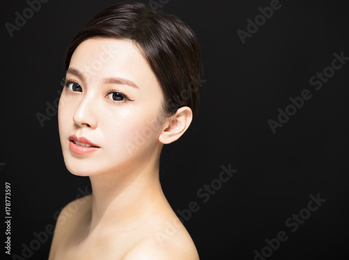 closeup Beauty woman face isolated on black background