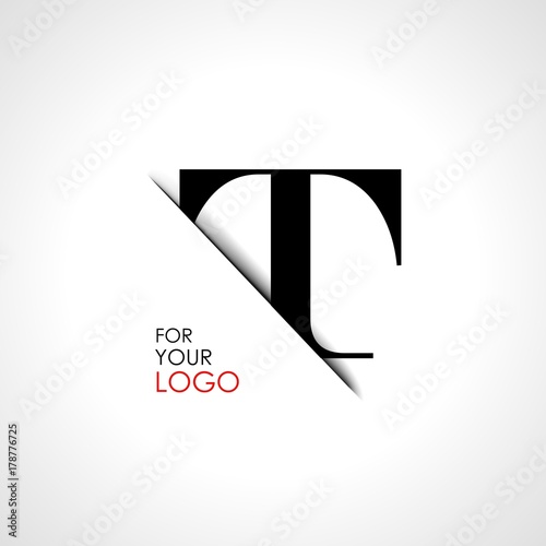 Capital t letter is inserted in the paper slot. To create logos, emblems, monograms