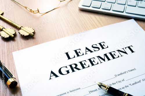 Rental lease agreement form on an office desk. photo
