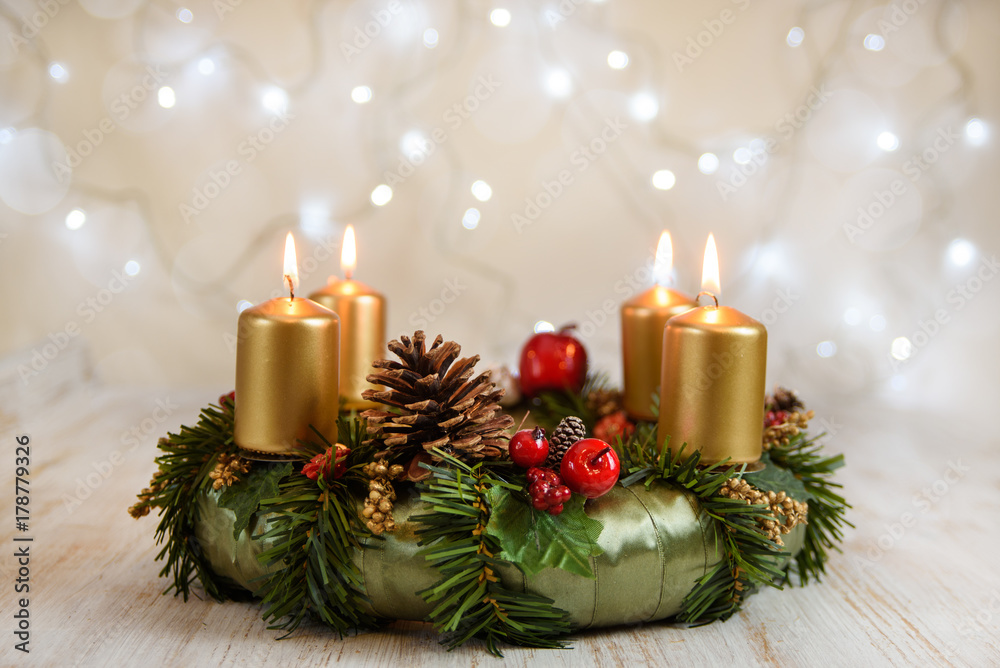 Advent wreath with burning candles for the Christmas time