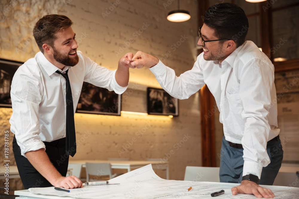 Fotografie Two successful confident smart businessmen working