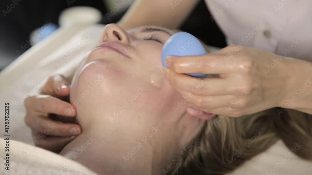 vacuum face massage, beautician does massage with vacuum banks. vacuum face massage, beautician does massage with vacuum banks.