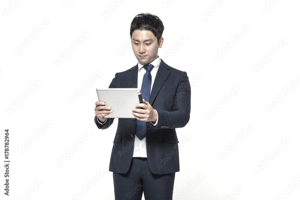 business man standing up with smart pad(tablet pc) isolated white.