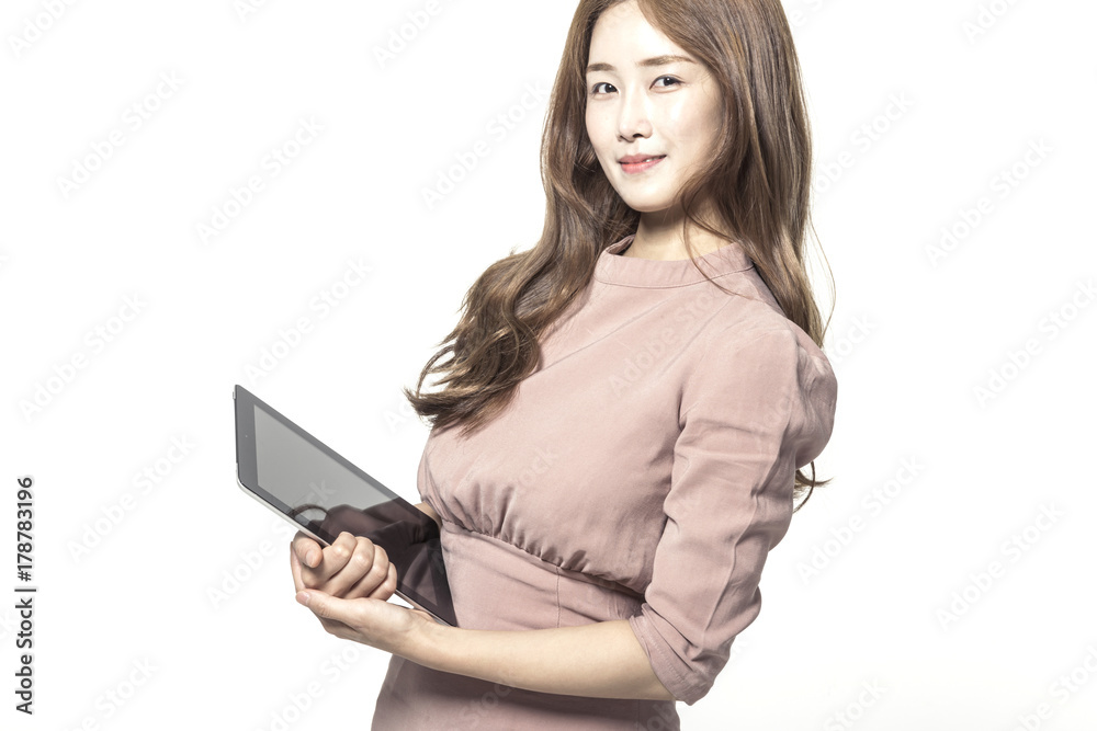 asian business woman standing up with tablet pc (pad) isolated white. asian business woman standing up with tablet pc (pad) isolated white.