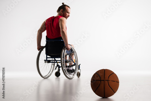 paralympic in wheelchair with basketball ball © LIGHTFIELD STUDIOS