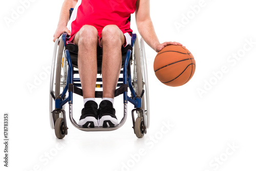 sportsman in wheelchair playing basketball