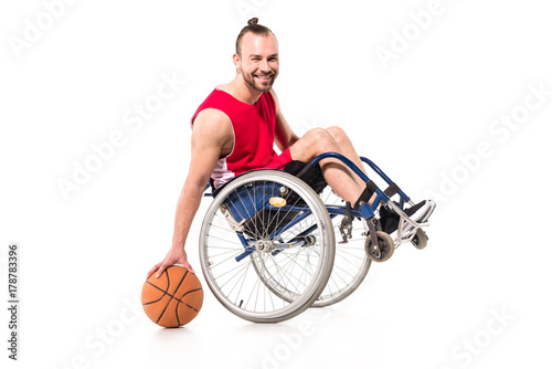 sportsman in wheelchair playing basketball