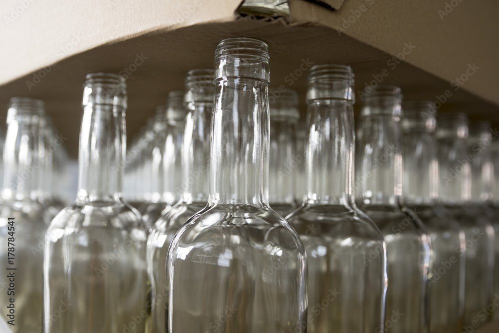 Empty glass bottles. Whiskey and brandy distillery Empty glass bottles. Whiskey and brandy distillery