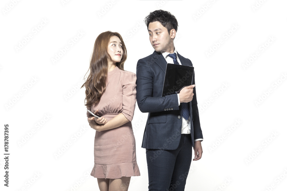 business man and woman standing up with smart device isolated white. business man and woman standing up with smart device isolated white.