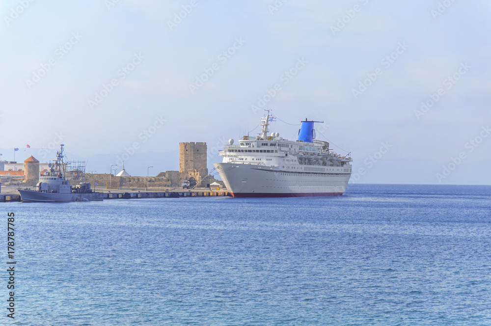 Big cruise white ship for luxury vacation docked at marina waiting passengers
