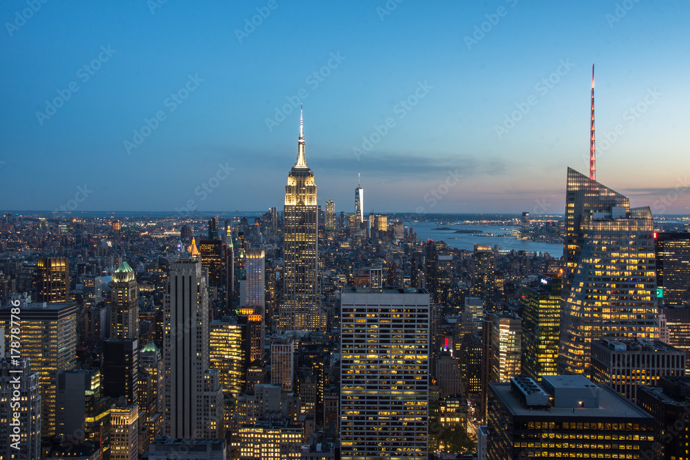 Φωτογραφία New York City Manhattan Times Square panorama aerial view at night with office building skyscrapers skyline illuminated by Hudson River