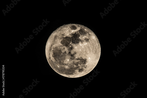 Full moon in sky on black background