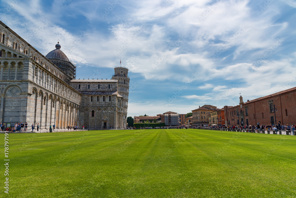 Stunning daily view at the Pisa Baptistery, the Pisa Cathedral and the Tower of Pisa. They are located in the Piazza dei Miracoli (Square of Miracles) in Pisa, Italy.