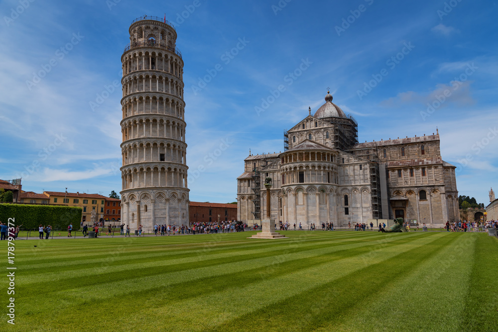Stunning daily view at the Pisa Baptistery, the Pisa Cathedral and the Tower of Pisa. They are located in the Piazza dei Miracoli (Square of Miracles) in Pisa, Italy. 