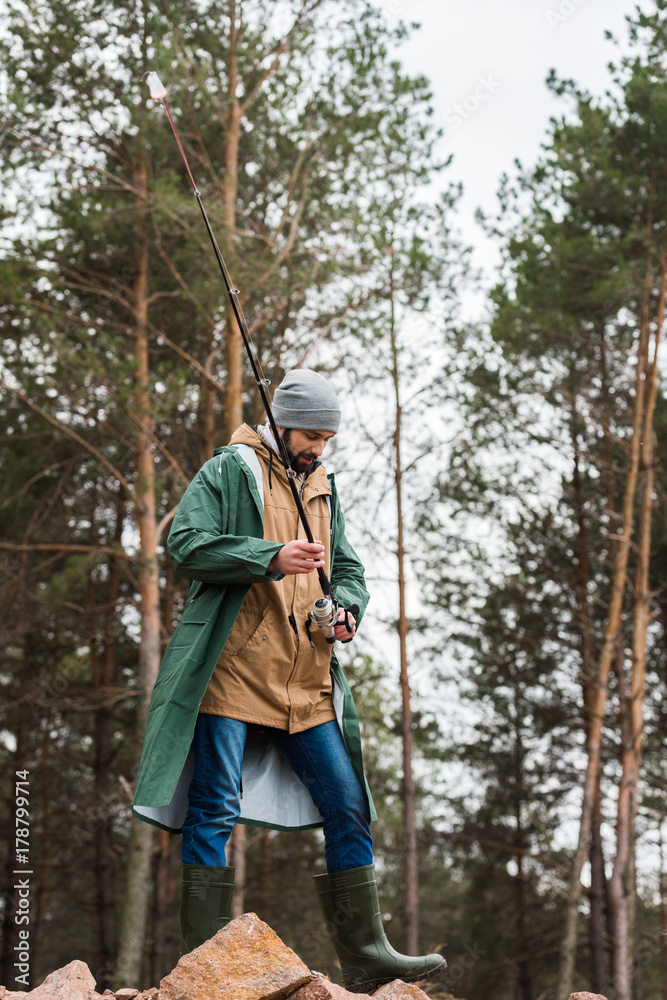 man with fishing rod man with fishing rod