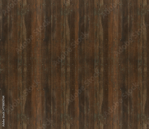 Old weathered and damaged brown wooden door background or texture