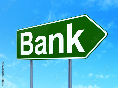 Currency concept: Bank on green road highway sign, clear blue sky background, 3D rendering