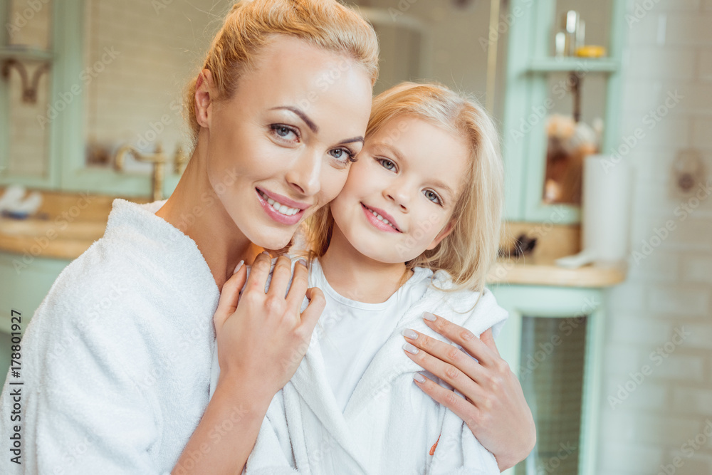mother and daughter in bathrobes