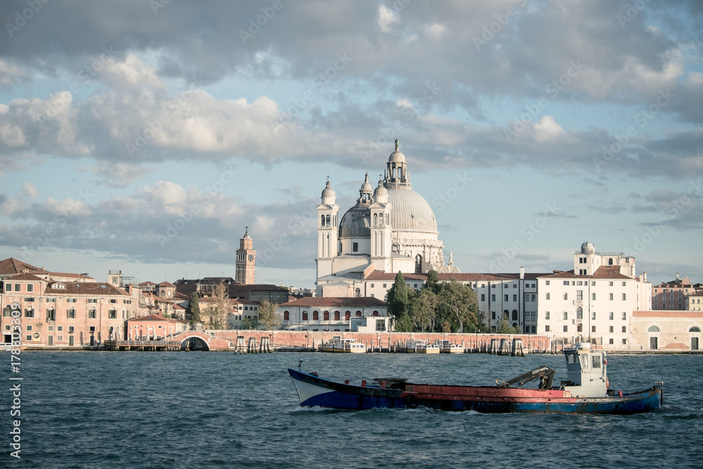 Basilica di Santa Maria della Salute, Background Venice in Italy with boats and church Salute, Basilica Salute with ship in Venice