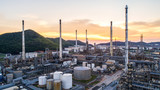 Aerial view Oil refinery.Industrial view at oil refinery plant form industry zone with sunrise and cloudy sky.Oil refinery and Petrochemical plant at dusk,Thailand. Oil refinery background sunset.