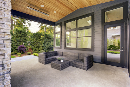 New modern home features a backyard with patio